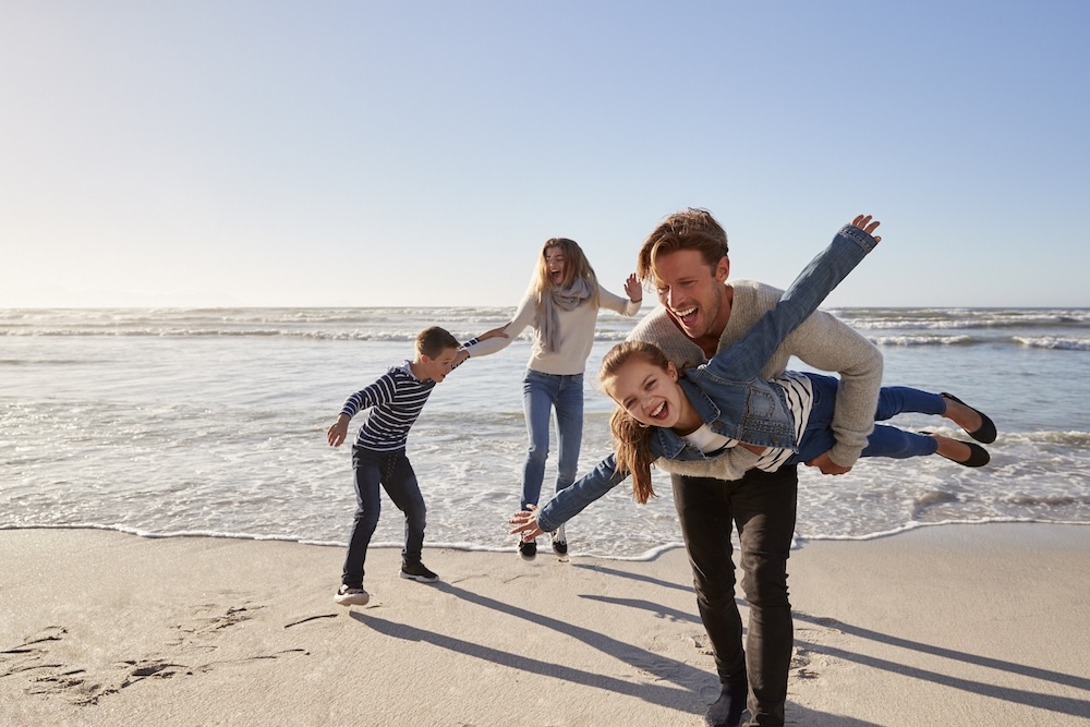 Family having fun on a calm beach